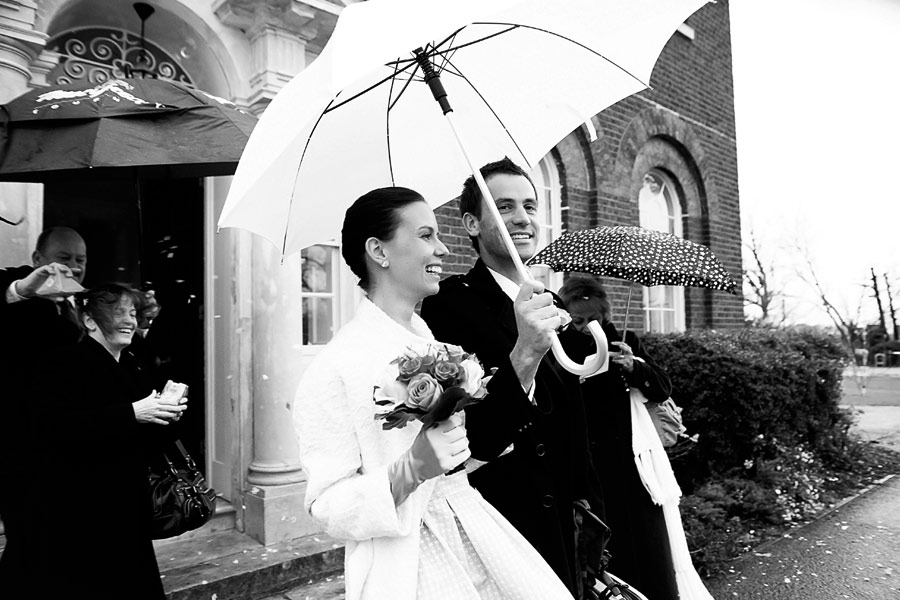 Happy bride and groom with confetti