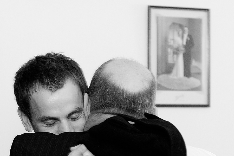 Groom and his father hugging